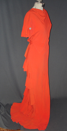 Pre-WWII evening gown. Orange polyester with peplum ruffles down the back
