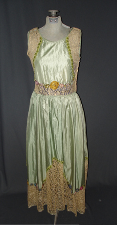 Early 1920s dress with slight drop waist. Mint green satin with ivory machine lace