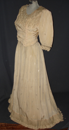 Wedding dress. Cream silk brocade with lace edges