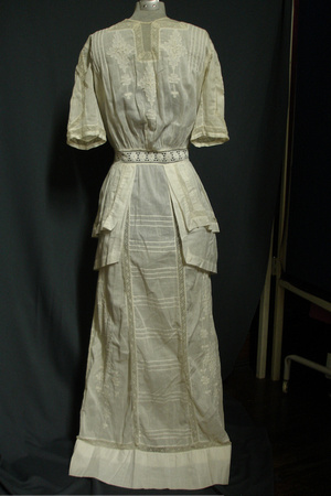 Edwardian day dress, c. 1905-1910. Ivory cotton with white embroidery and prplum details at waist